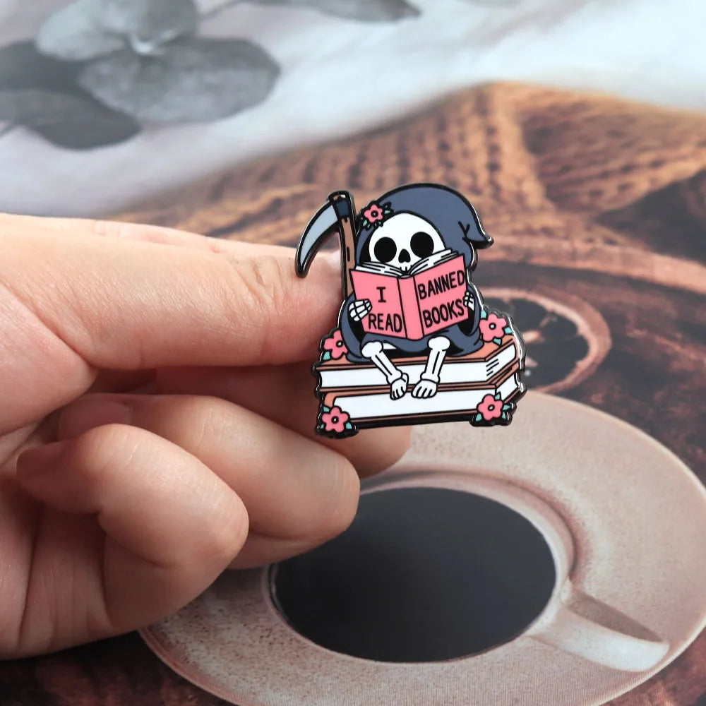 I Read Banned Books — Gothic Skeleton Reader Enamel Pin