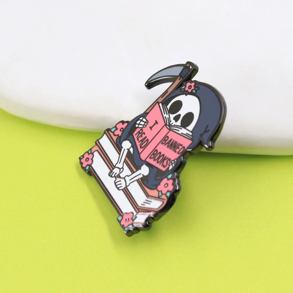 I Read Banned Books — Gothic Skeleton Reader Enamel Pin
